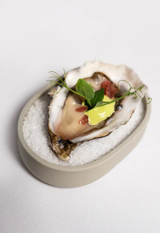 Oesters met bieslook en framboos vinaigrette